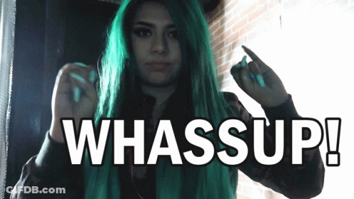 A Woman With Green Hair Is Giving The Middle Finger And The Words Whassup Are Above Her GIF