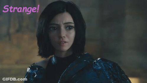 A Woman With Green Hair Is Standing In Front Of A Sign That Says " Strange " GIF