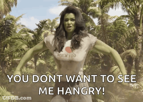 A Woman With Green Hair Is Wearing A Mexico Shirt GIF