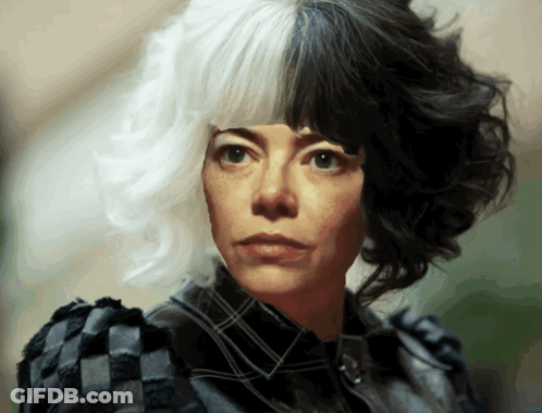 A Woman With Half Black And Half White Hair Is Wearing A Plaid Shirt GIF