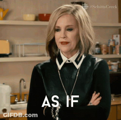 A Woman With Her Arms Crossed Says As If In A Kitchen GIF