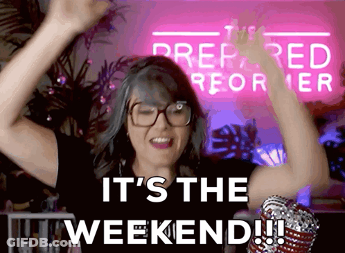 A Woman With Her Arms In The Air With The Words It 'S The Weekend GIF