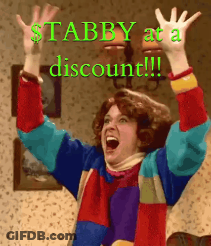 A Woman With Her Arms In The Air With The Words Stabby At A Discount Written Below Her GIF