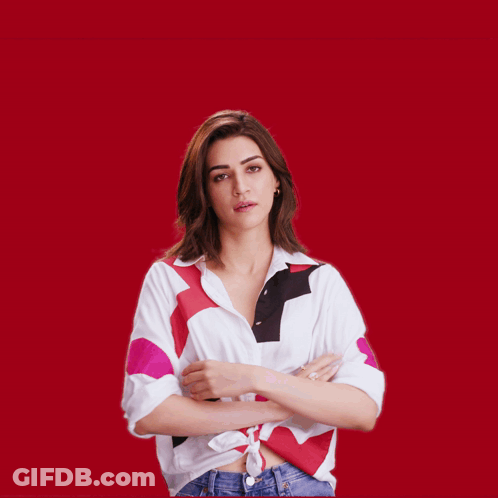 A Woman With Her Arms Outstretched Looks Surprised GIF