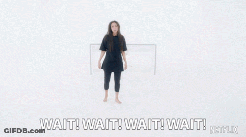 A Woman With Her Arms Outstretched Says Wait Wait Wait Wait Netflix GIF
