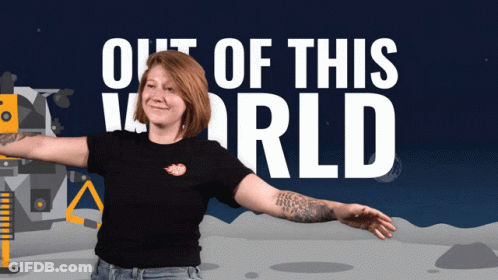 A Woman With Her Arms Outstretched Stands In Front Of A Poster That Says Out Of This World GIF