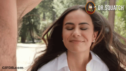 A Woman With Her Eyes Closed And A Dr.squatch Logo On The Bottom GIF