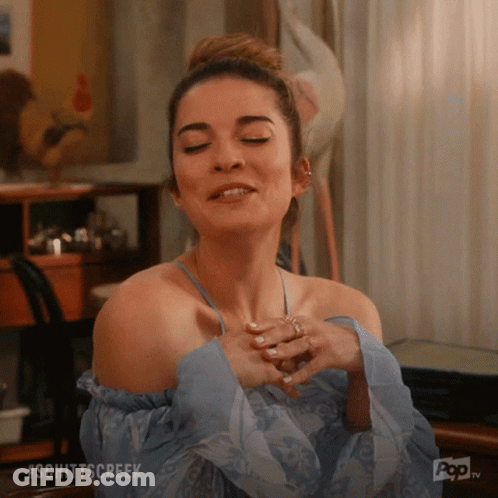 A Woman With Her Eyes Closed And The Word Schittscreek Written On The Bottom GIF
