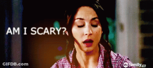 A Woman With Her Eyes Closed And The Words Am I Scary GIF