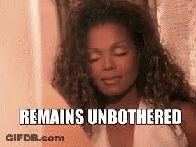 A Woman With Her Eyes Closed And The Words `` Remains Unbothered '' Written On Her Face . GIF