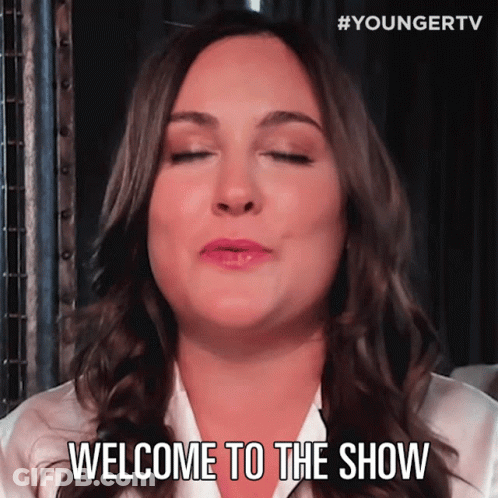 A Woman With Her Eyes Closed And The Words Welcome To The Show Below Her GIF