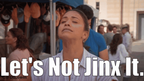 A Woman With Her Eyes Closed Has The Words Let 'S Not Jinx It Written On Her Face GIF