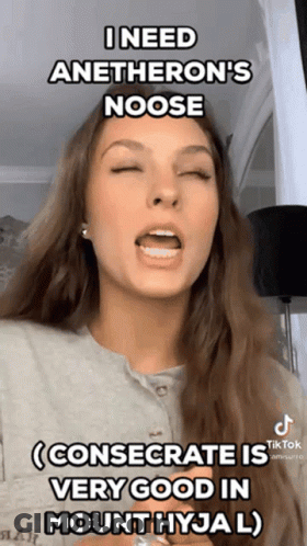 A Woman With Her Eyes Closed Is Making A Funny Face GIF