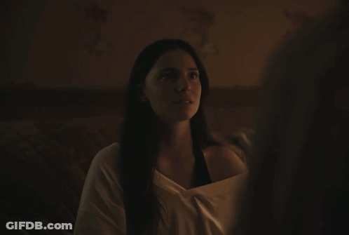 A Woman With Her Eyes Closed Looks At Another Woman GIF