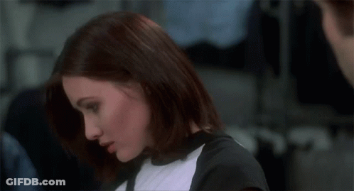 A Woman With Her Eyes Closed Says " For What " In Front Of A Man GIF