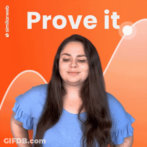 A Woman With Her Eyes Closed Stands In Front Of A Sign That Says Prove It GIF