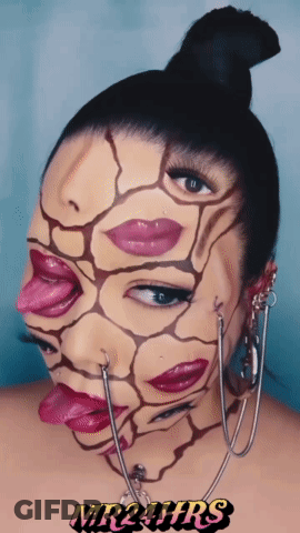 A Woman With Her Face Painted Has Mr24hrs Written On The Bottom Right GIF
