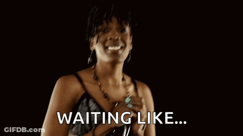 A Woman With Her Hands Folded And The Words Waiting Like Written On The Bottom GIF