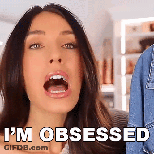 A Woman With Her Mouth Open And The Words I 'M Obsessed Below Her GIF