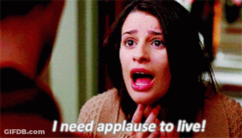 A Woman With Her Mouth Open And The Words I Need Applause To Live GIF
