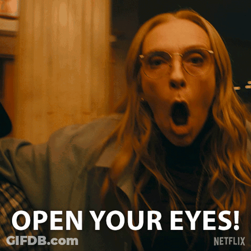 A Woman With Her Mouth Open And The Words " Open Your Eyes " Behind Her GIF