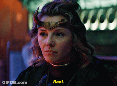 A Woman With Horns On Her Head Is Wearing A Black Shirt With The Word Real On It GIF