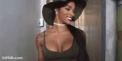A Woman With Large Breasts Is Wearing A Hat And A Choker . GIF