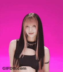 A Woman With Long Black Hair And Pink Highlights Is Wearing A Black Top GIF
