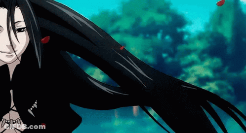 A Woman With Long Black Hair Is Blowing In The Wind GIF