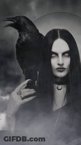 A Woman With Long Black Hair Is Holding A Black Crow On Her Shoulder GIF