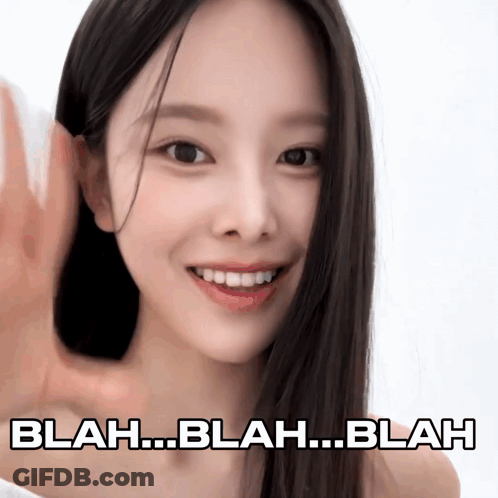 A Woman With Long Black Hair Is Smiling With Blah Blah Blah Written Below Her GIF