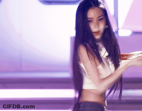 A Woman With Long Black Hair Is Wearing A Crop Top GIF