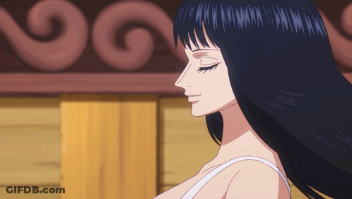 A Woman With Long Black Hair Is Wearing A White Top GIF