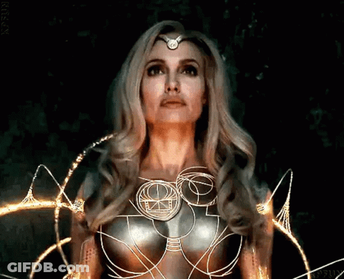 A Woman With Long Blonde Hair And A Crown On Her Head GIF