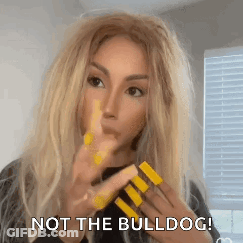 A Woman With Long Blonde Hair And Yellow Nails Is Making A Funny Face And Says `` Not The Bulldog '' . GIF