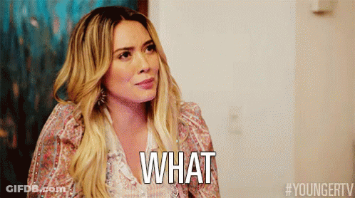 A Woman With Long Blonde Hair Is Asking What GIF