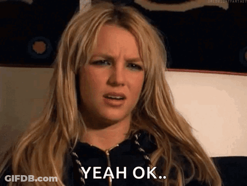 A Woman With Long Blonde Hair Is Making A Funny Face And Saying Yeah Ok . GIF