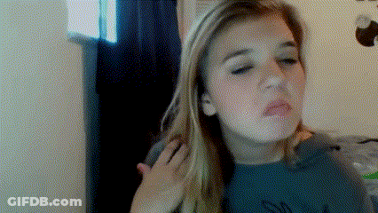A Woman With Long Blonde Hair Is Making A Funny Face With Her Hand On Her Shoulder GIF
