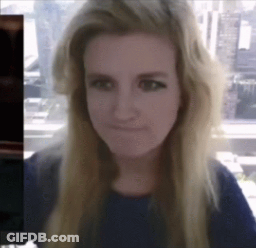 A Woman With Long Blonde Hair Is Making A Funny Face GIF