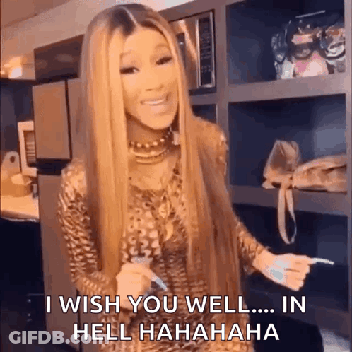 A Woman With Long Blonde Hair Is Standing In A Kitchen Holding A Toothbrush And Saying I Wish You Well In Hell . GIF