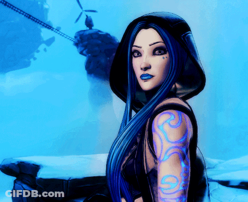 A Woman With Long Blue Hair Has A Tattoo On Her Arm With The Letter S On It GIF