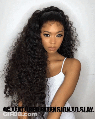 A Woman With Long Curly Hair And The Words 4C Textured Extension To Slay On The Bottom GIF