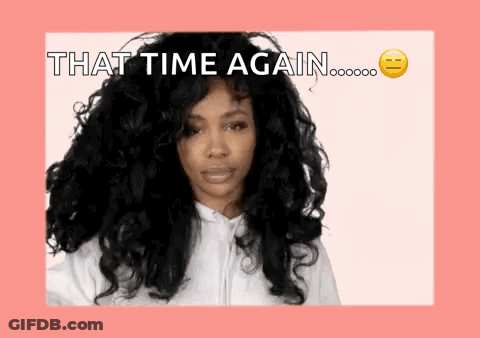 A Woman With Long Curly Hair Is Wearing A White Hoodie And Says That Time Again . GIF