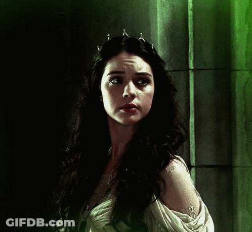 A Woman With Long Dark Hair Wearing A Tiara On Her Head GIF
