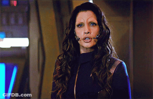 A Woman With Long Hair And A Fake Eyebrow GIF