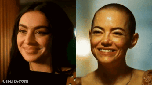 A Woman With Long Hair And A Woman With Shaved Hair GIF