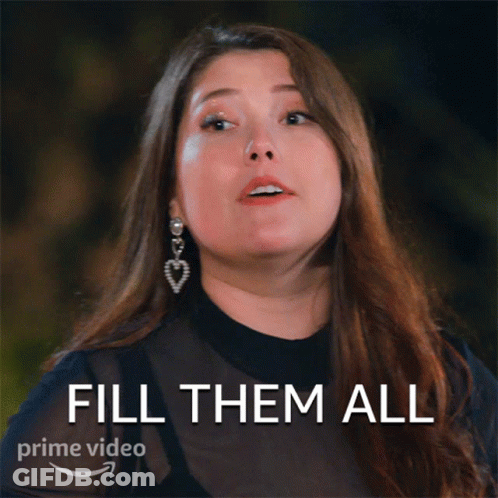 A Woman With Long Hair And Earrings Says Fill Them All On A Prime Video Ad GIF