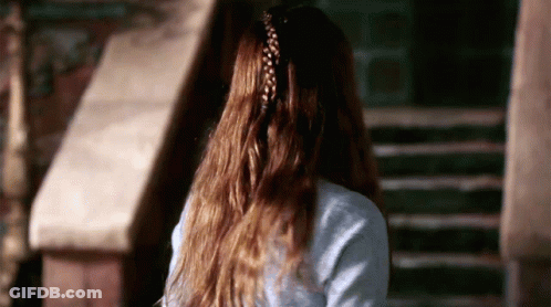 A Woman With Long Hair Has A Braided Ponytail GIF