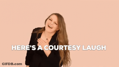 A Woman With Long Hair Is Laughing With The Words `` Here 'S A Courtesy Laugh '' Above Her . GIF