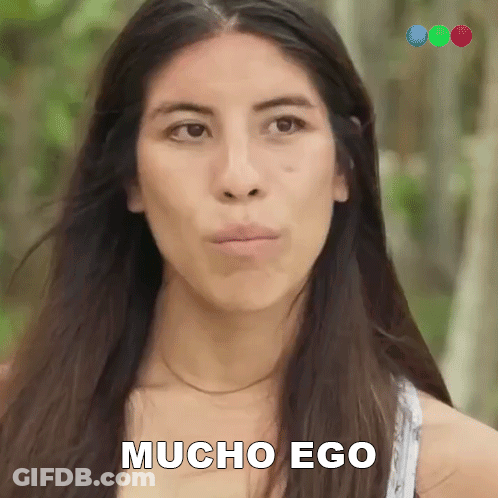 A Woman With Long Hair Is Making A Funny Face And The Words Mucho Ego Are On Her Face GIF
